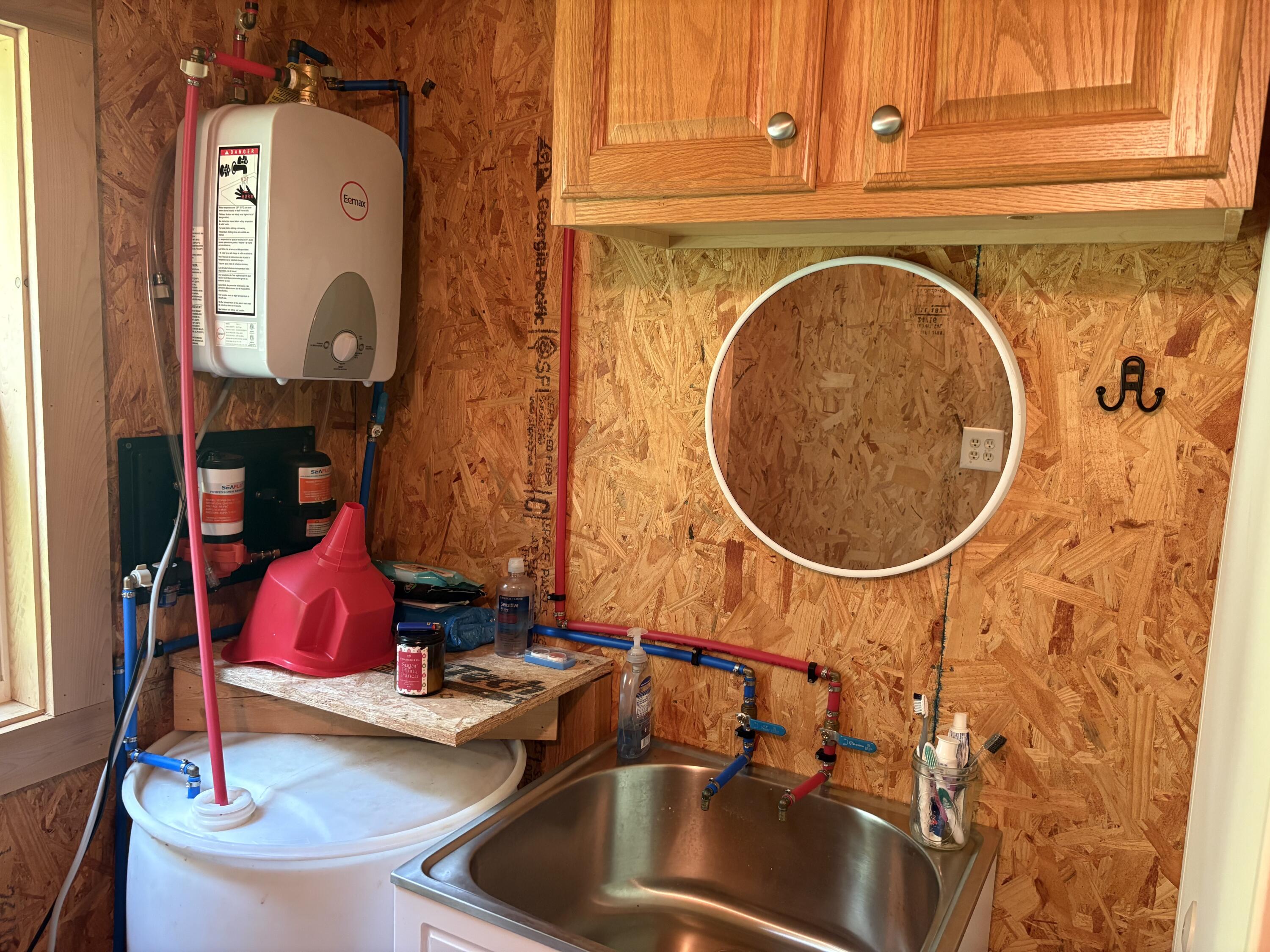 1509 Oxbow Road Oxbow, ME 04764 - Photo 22 of 22 Hot water heater on the wall