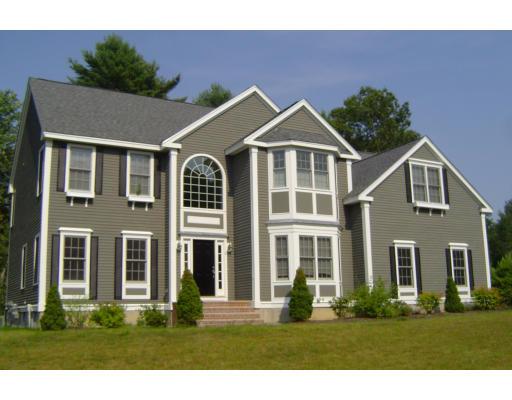 8 Stonebridge Road Groveland, MA 01834 - Photo 1 of 20 a front view of a house with a yard
