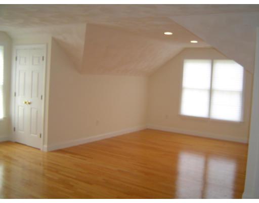 8 Stonebridge Road Groveland, MA 01834 - Photo 12 of 20 an empty room with wooden floor and windows
