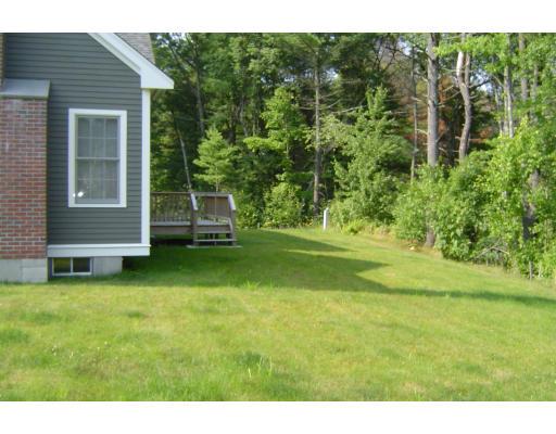 8 Stonebridge Road Groveland, MA 01834 - Photo 18 of 20 a view of a house with a backyard