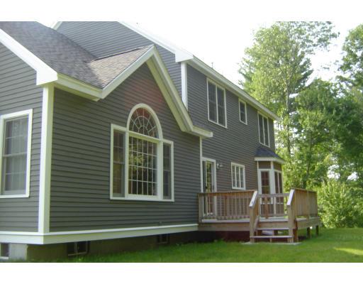 8 Stonebridge Road Groveland, MA 01834 - Photo 19 of 20 a front view of a house with a garden