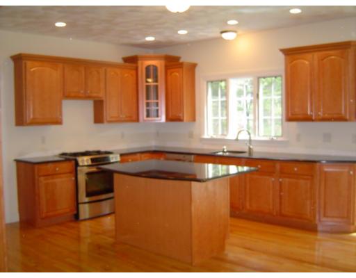 8 Stonebridge Road Groveland, MA 01834 - Photo 6 of 20 a kitchen with stainless steel appliances granite countertop a stove a sink and a microwave