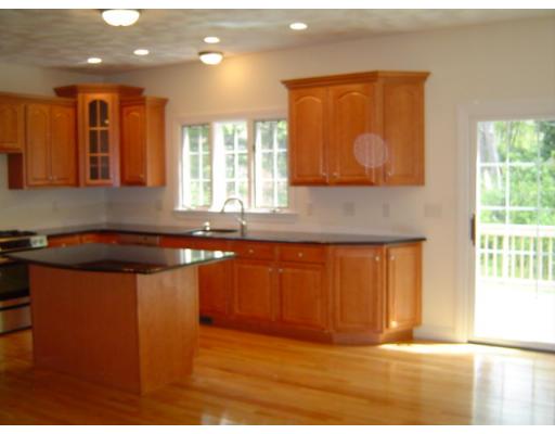 8 Stonebridge Road Groveland, MA 01834 - Photo 7 of 20 a kitchen with stainless steel appliances granite countertop a stove a sink and a microwave