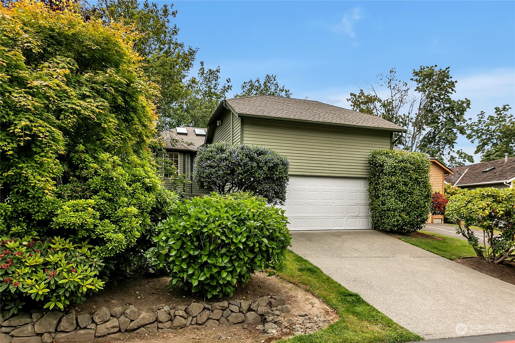 2052 Southeast 8th Place Renton, WA 98057 - Photo 2 of 33 front view of a house with a yard