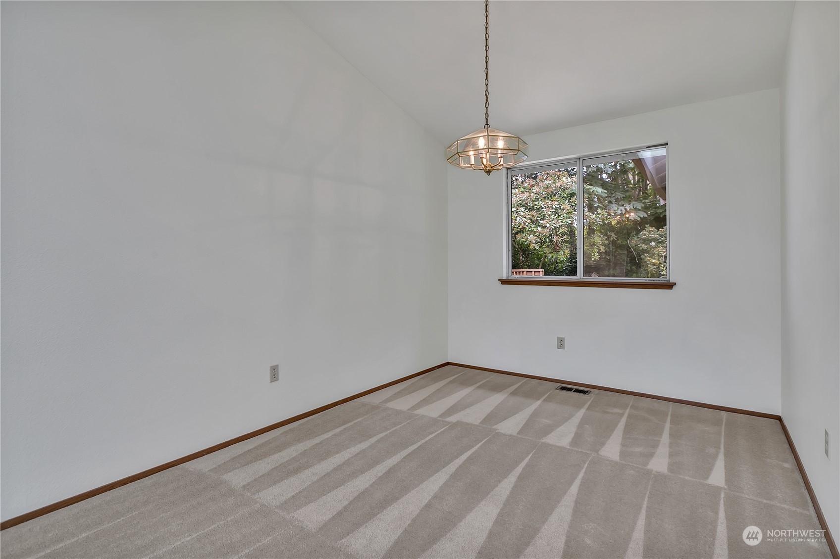 2052 Southeast 8th Place Renton, WA 98057 - Photo 9 of 33 a view of empty room with window
