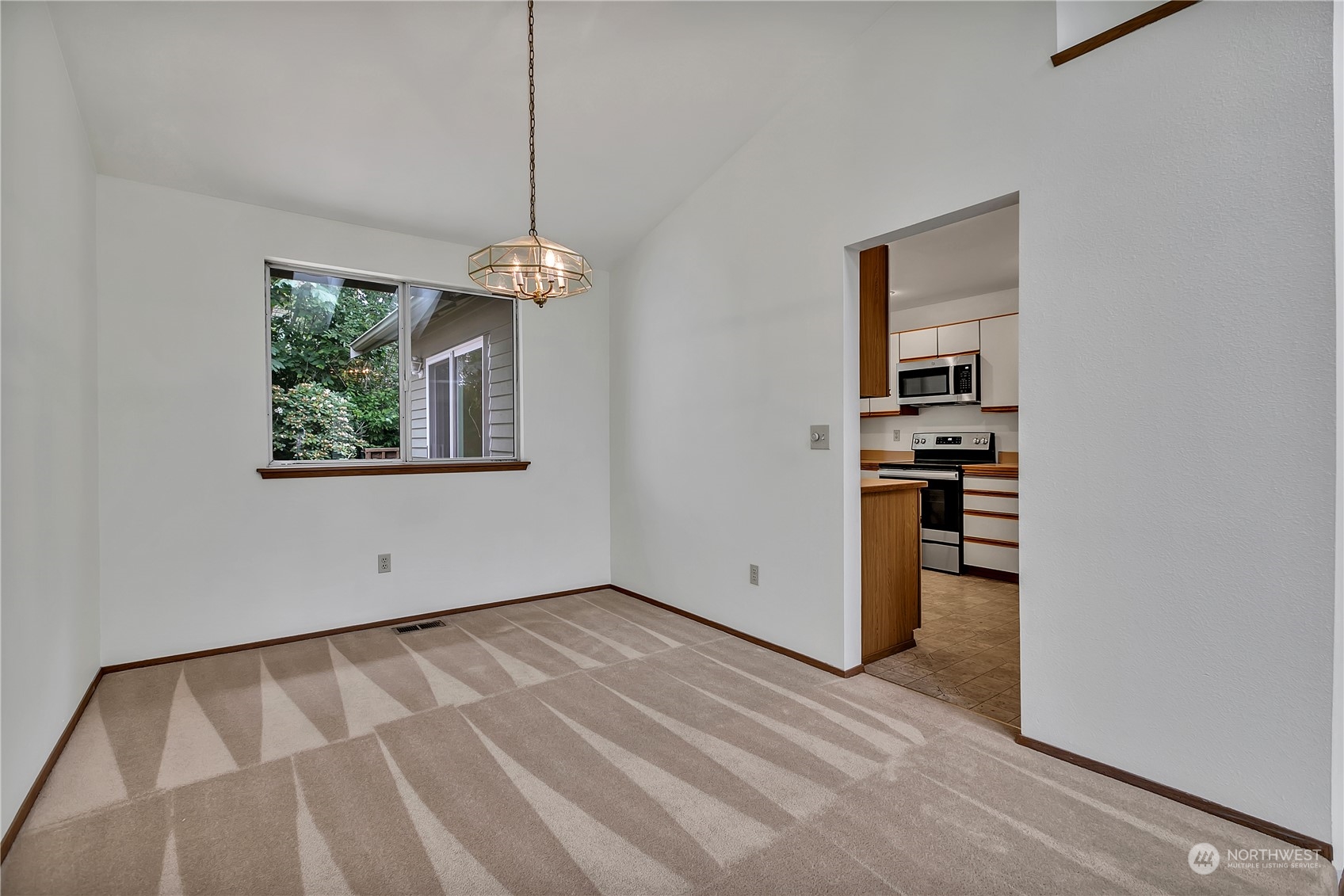 2052 Southeast 8th Place Renton, WA 98057 - Photo 10 of 33 a view of empty room with wooden floor and fan