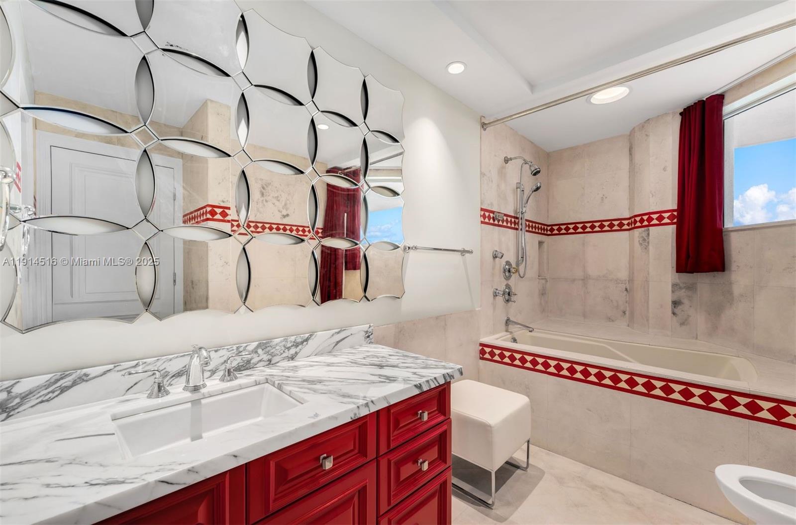 5025 Collins Avenue, Unit PH1 Miami Beach, FL 33140 - Photo 35 of 62 a bathroom with a sink vanity granite and shower