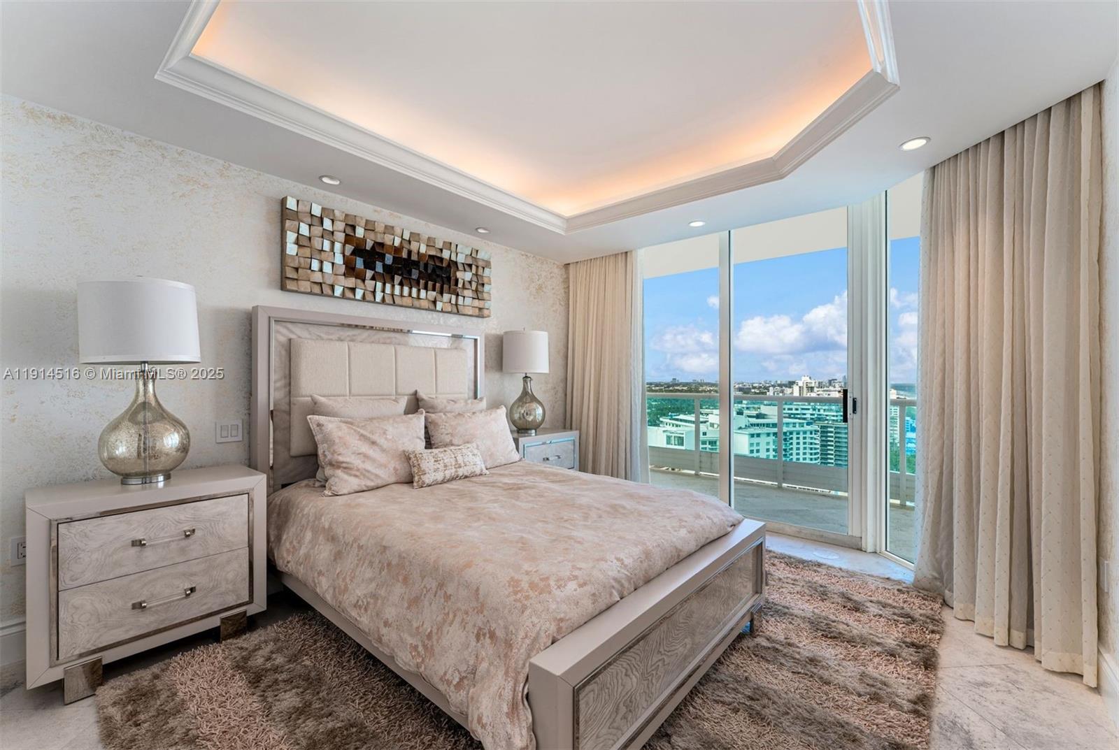 5025 Collins Avenue, Unit PH1 Miami Beach, FL 33140 - Photo 36 of 62 a bedroom with a large bed and a window