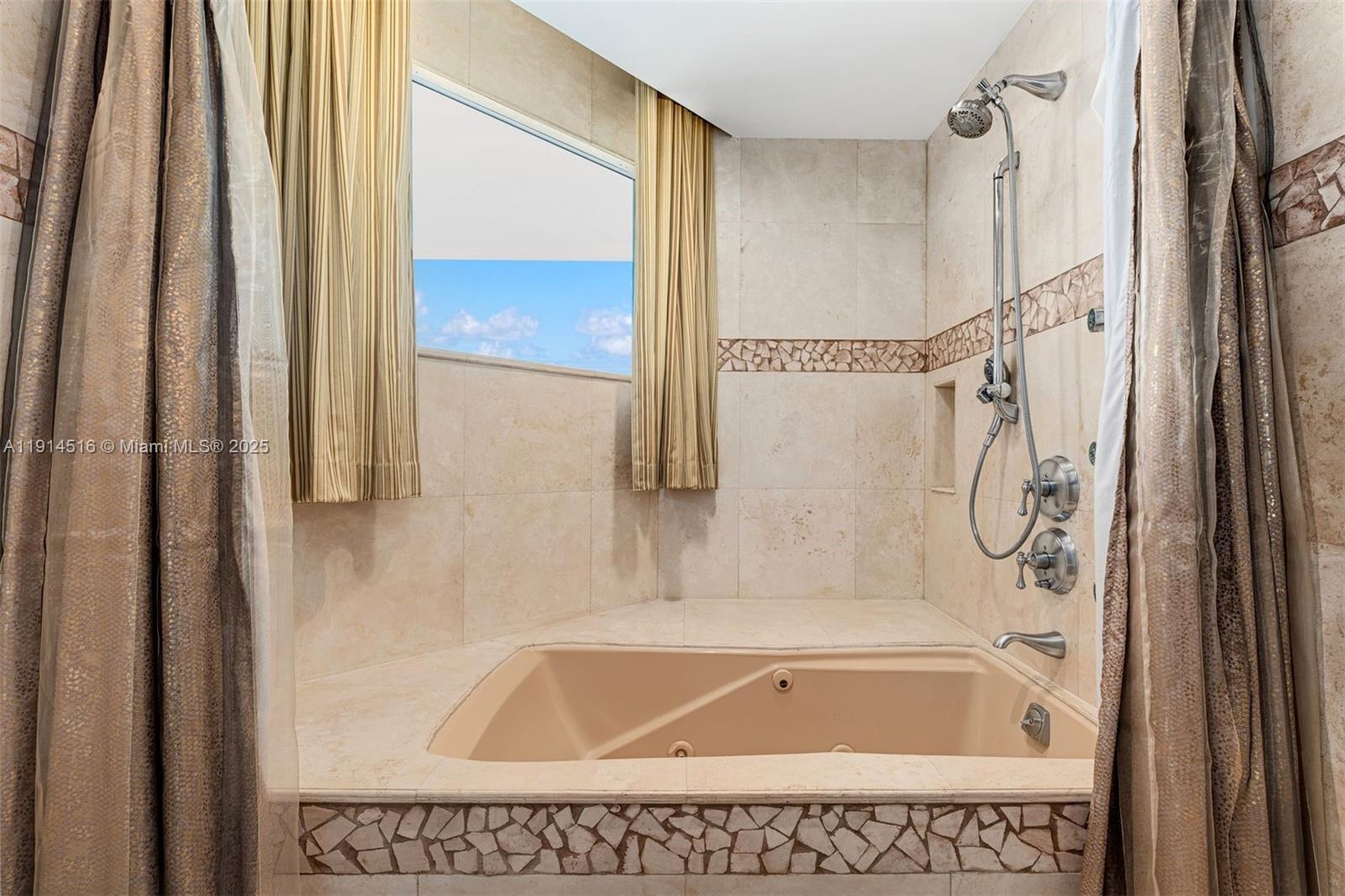 5025 Collins Avenue, Unit PH1 Miami Beach, FL 33140 - Photo 38 of 62 a bathroom with a bath tub and shower
