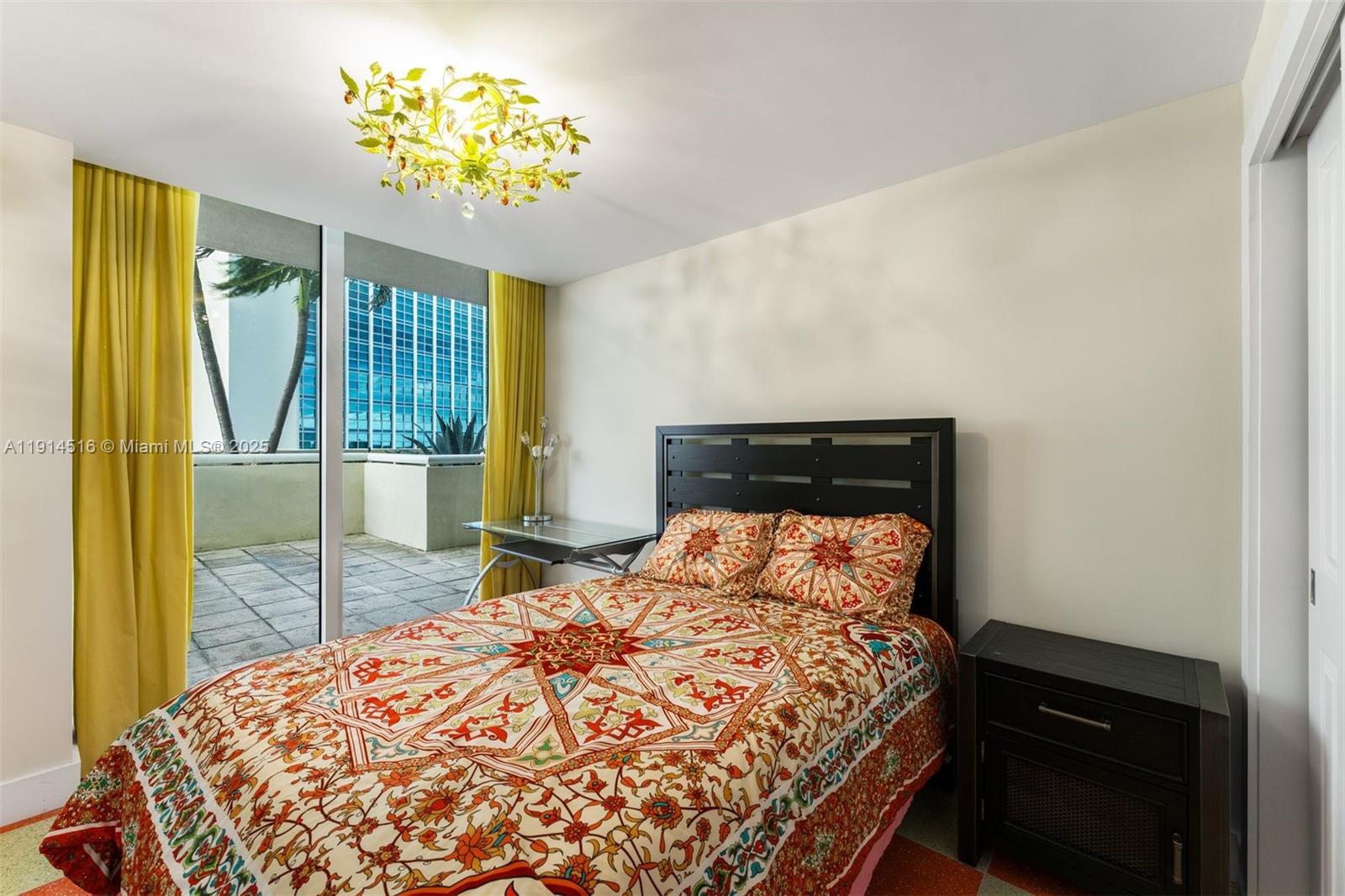 5025 Collins Avenue, Unit PH1 Miami Beach, FL 33140 - Photo 47 of 62 a bedroom with a bed and a dresser