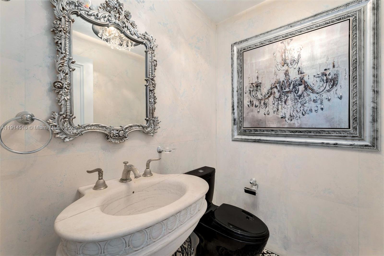 5025 Collins Avenue, Unit PH1 Miami Beach, FL 33140 - Photo 9 of 62 a bathroom with a sink and a mirror