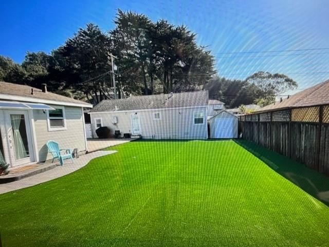 333 Brighton Road Pacifica, CA 94044 - Photo 14 of 14 a view of a backyard with a garden and deck
