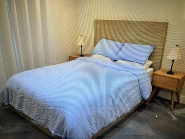 333 Brighton Road Pacifica, CA 94044 - Photo 6 of 14 a bed sitting in a bedroom next to a window