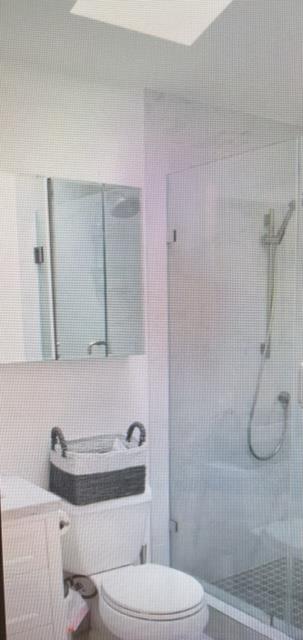 333 Brighton Road Pacifica, CA 94044 - Photo 7 of 14 a bathroom with a toilet sink and shower