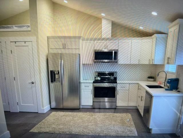 333 Brighton Road Pacifica, CA 94044 - Photo 9 of 14 a kitchen with stainless steel appliances granite countertop a refrigerator a sink and a stove
