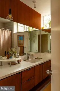 a living room with a large window and a table