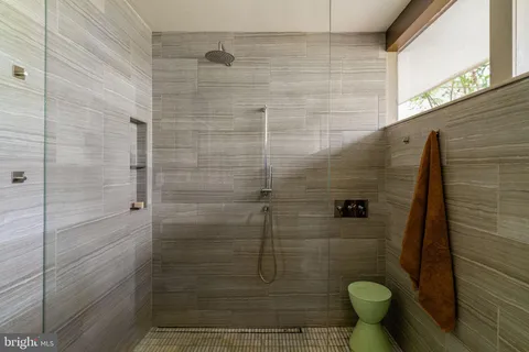 a view of a patio with table and chairs and potted plants
