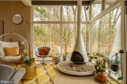 a view of a house with a yard covered in snow