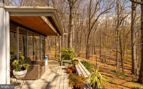 a view of swimming pool with an outdoor space and seating area