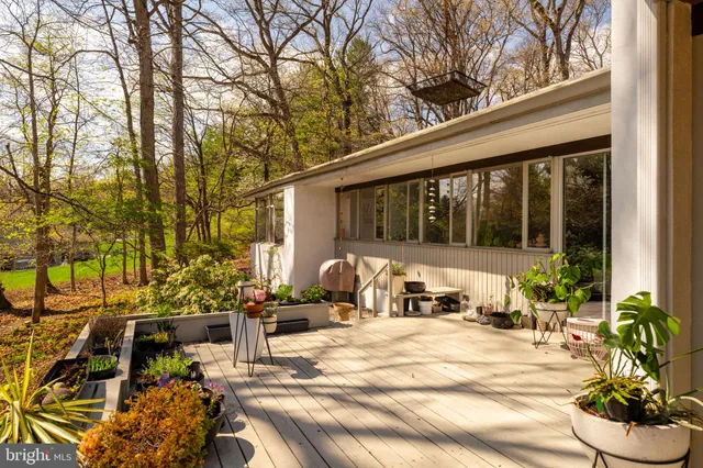 a view of a swimming pool with an outdoor space and seating area