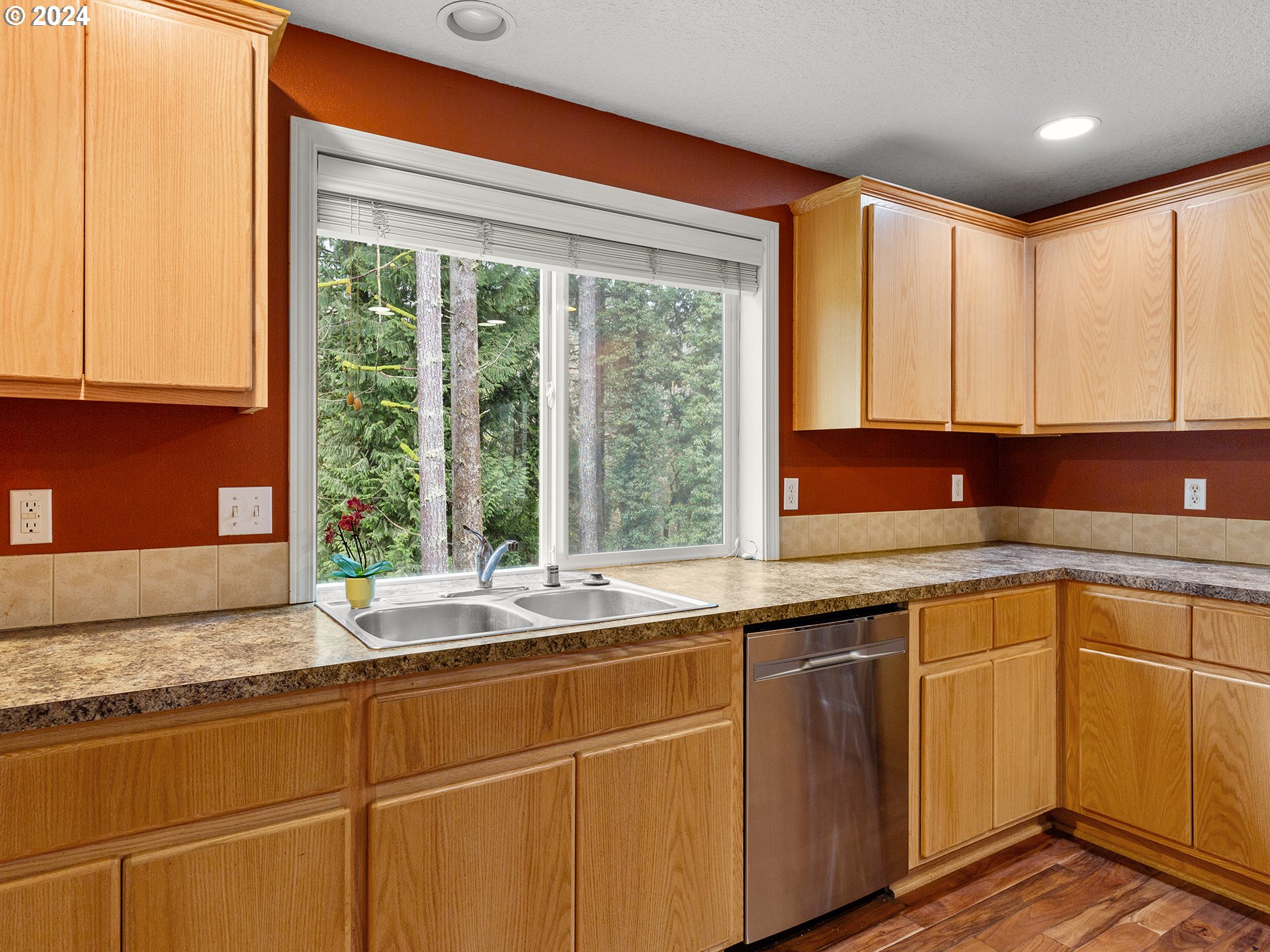 2931 South Cedar Ridge Drive Ridgefield, WA 98642 - Photo 8 of 22 a kitchen with stainless steel appliances granite countertop a sink and a window