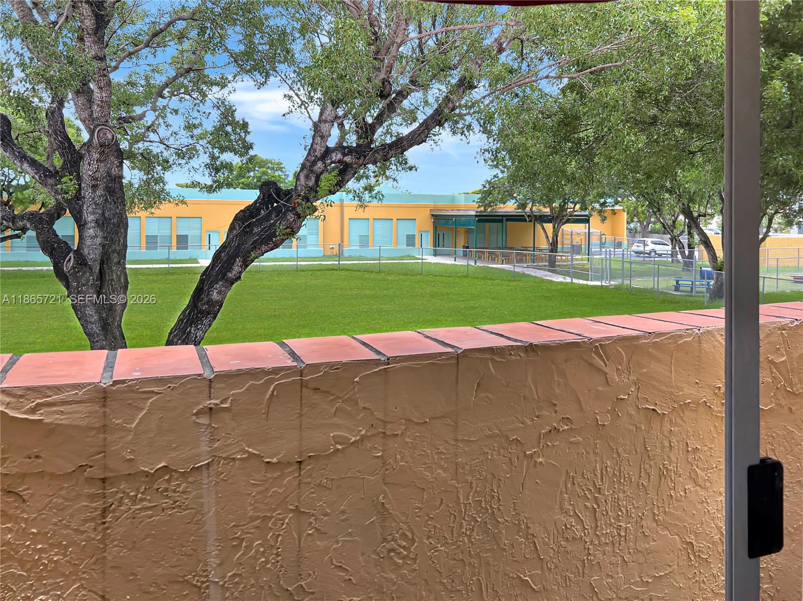 8515 Northwest 3rd Lane, Unit 1109 Miami, FL 33126 - Photo 13 of 14 a view of road with large trees