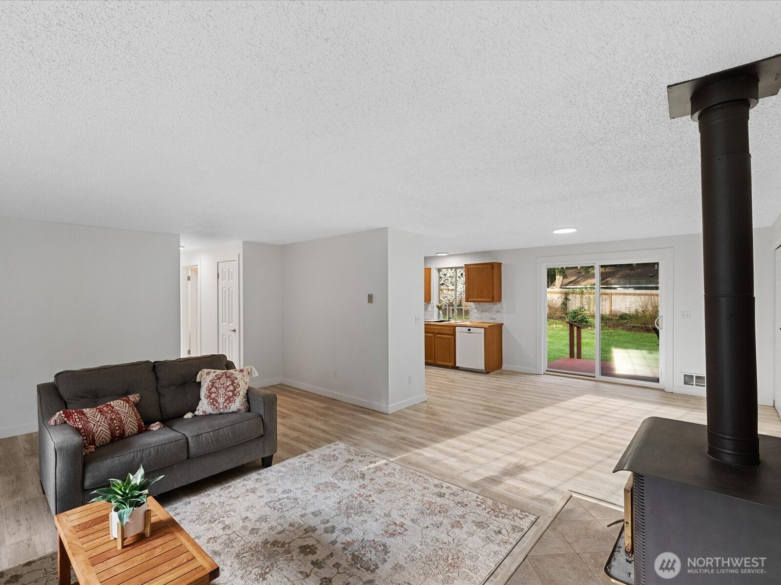 7822 Songbird Way Clinton, WA 98236 - Photo 15 of 28 a living room with furniture and a window