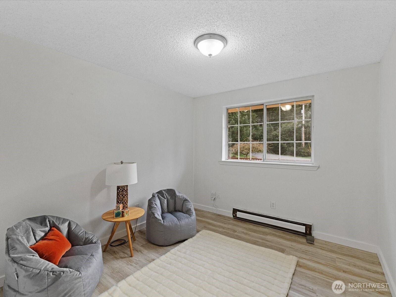 7822 Songbird Way Clinton, WA 98236 - Photo 17 of 28 a living room with furniture and a window
