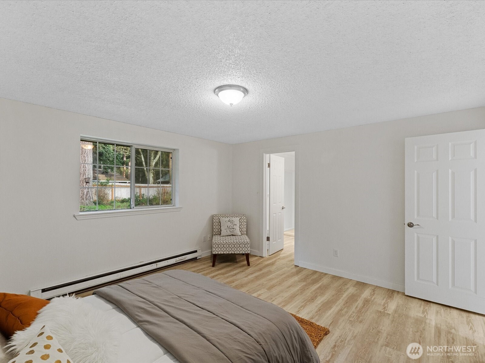 7822 Songbird Way Clinton, WA 98236 - Photo 20 of 28 a bedroom with a bed and a window