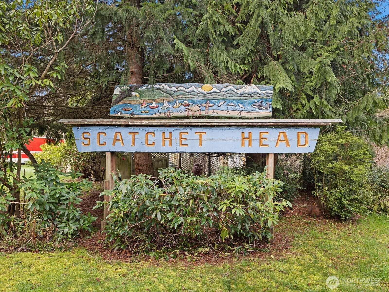 7822 Songbird Way Clinton, WA 98236 - Photo 26 of 28 front view of a building with a yard