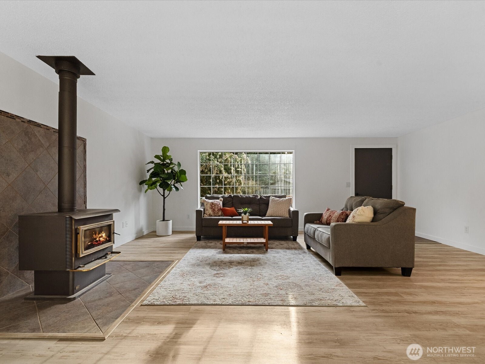 7822 Songbird Way Clinton, WA 98236 - Photo 5 of 28 a living room with furniture and a flat screen tv