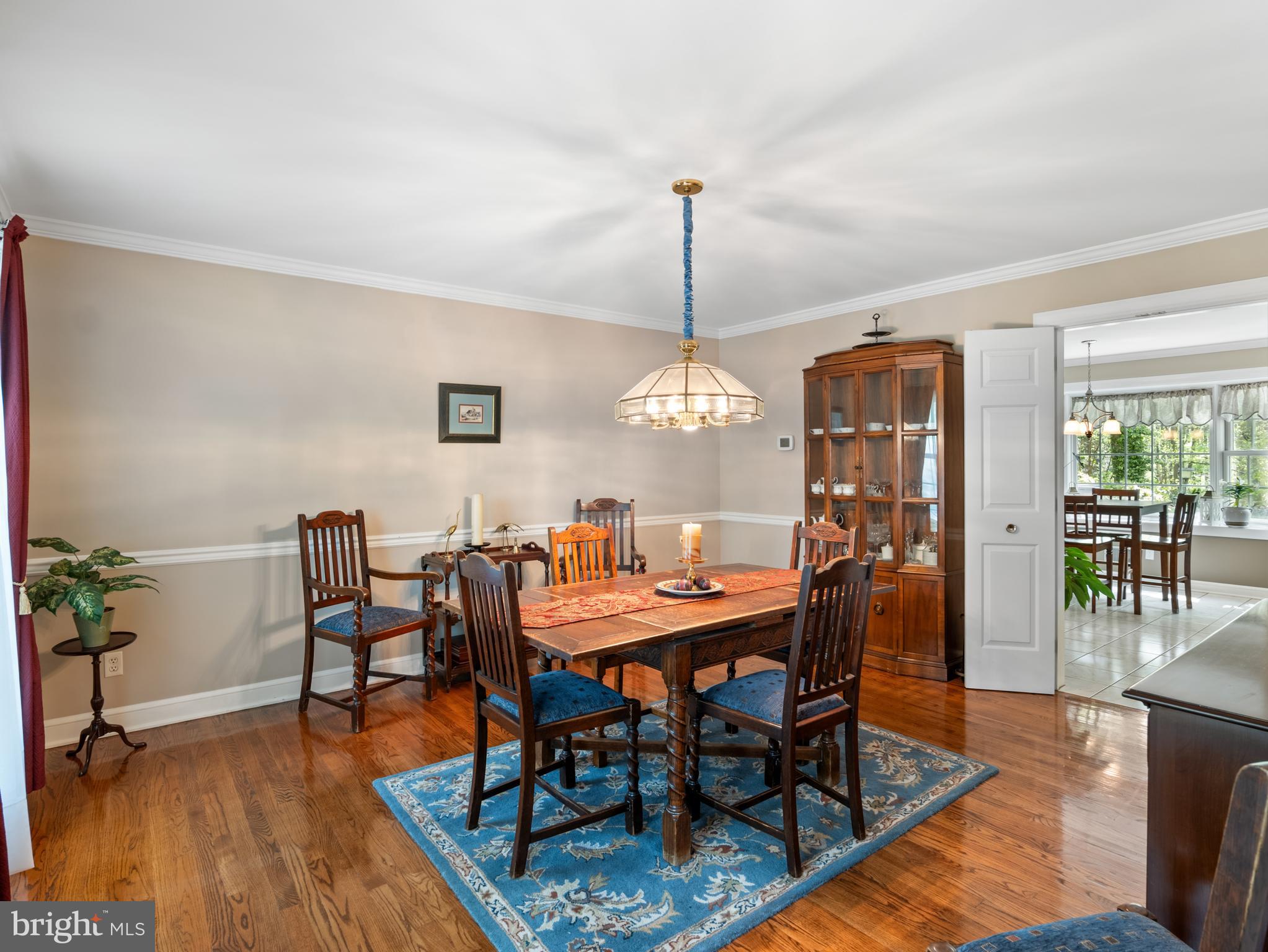 5 Radburn Lane Landenberg, PA 19350 - Photo 11 of 67 a view of a dining room with furniture wooden floor and chandelier