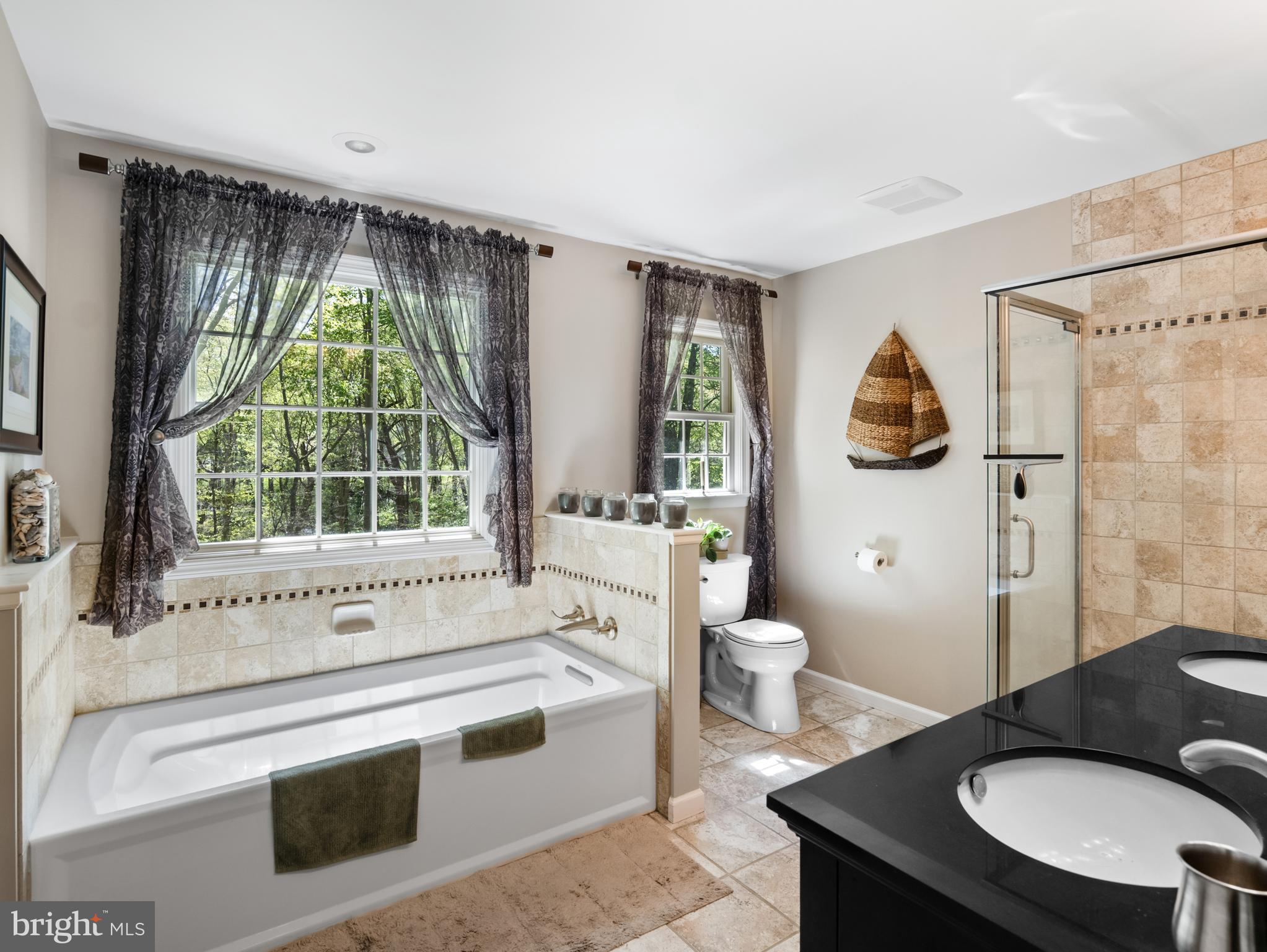 5 Radburn Lane Landenberg, PA 19350 - Photo 36 of 67 a spacious bathroom with a granite countertop sink toilet a mirror and shower