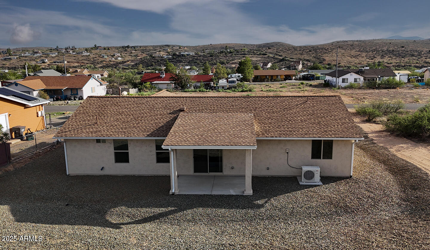 20214 East Mesa Verde Road Mayer, AZ 86333 - Photo 26 of 26 an aerial view of a house with a yard and mountain view in back