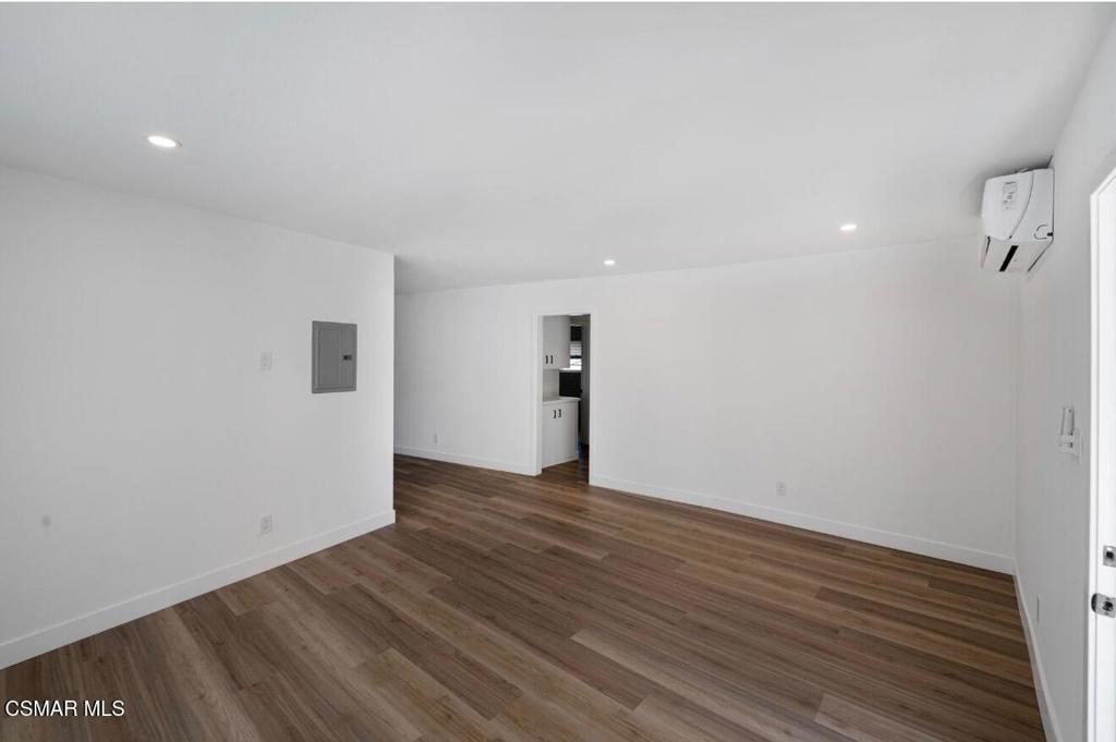 399 Erbes Road, Unit 1 Thousand Oaks, CA 91362 - Photo 11 of 16 a view of an empty room with wooden floor