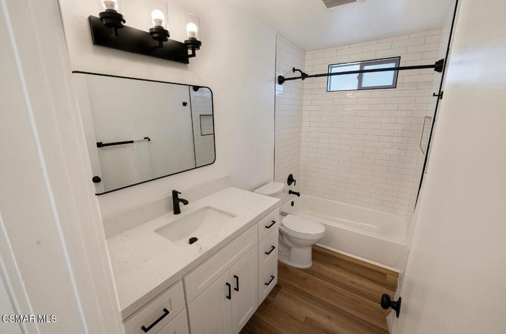 399 Erbes Road, Unit 1 Thousand Oaks, CA 91362 - Photo 12 of 16 a bathroom with a sink a toilet and shower