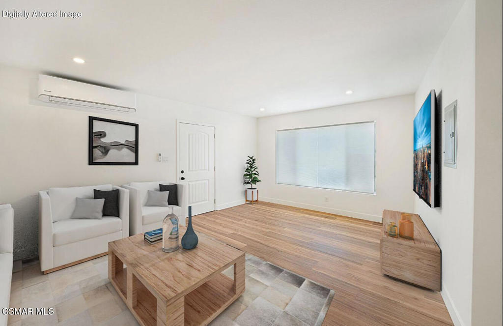 399 Erbes Road, Unit 1 Thousand Oaks, CA 91362 - Photo 5 of 16 a living room with furniture and a flat screen tv