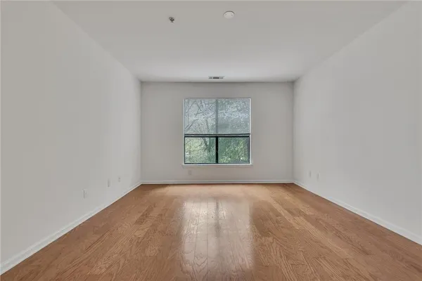 a view of a room that has a large window
