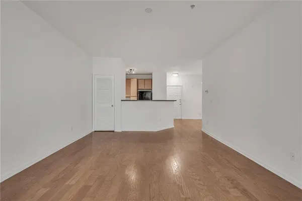 a view of a kitchen with a microwave and cabinets