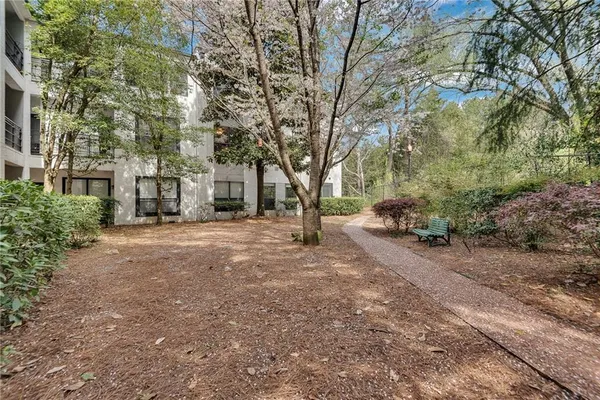 a front view of a building with garden