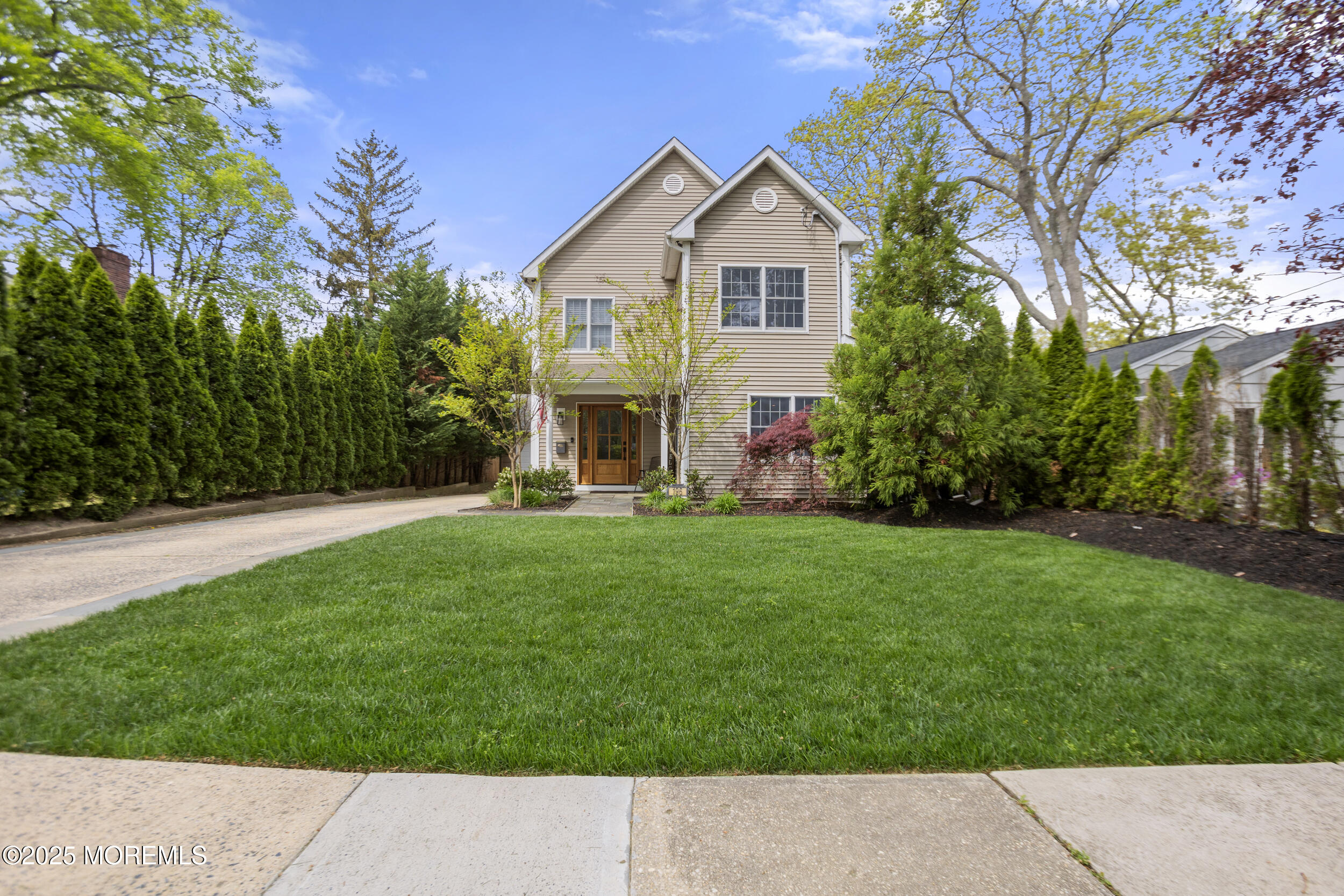 196 Highwood Road Oakhurst, NJ 07755 - Photo 1 of 32 a view of an house with backyard porch and garden