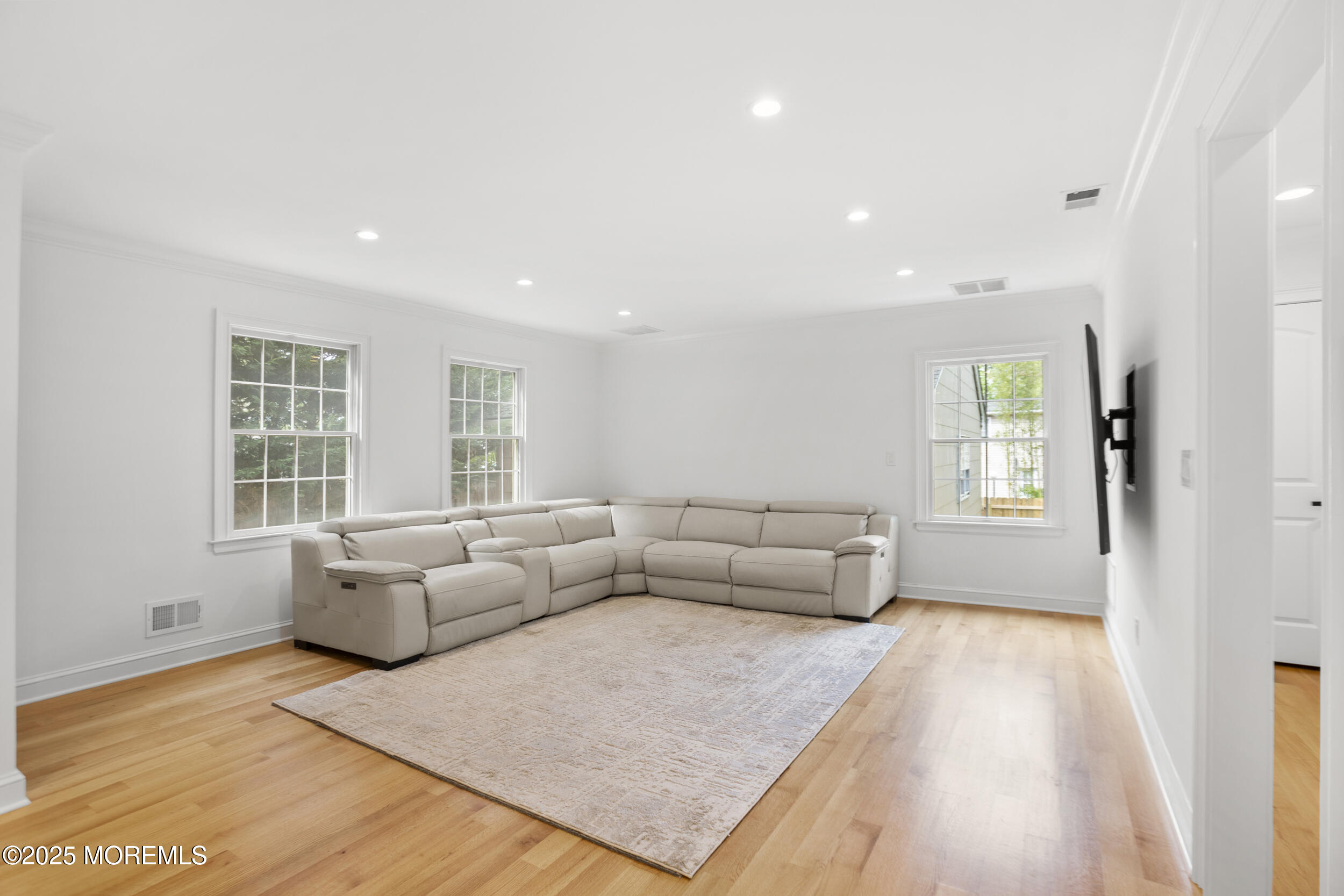 196 Highwood Road Oakhurst, NJ 07755 - Photo 14 of 32 a living room with furniture and a couch