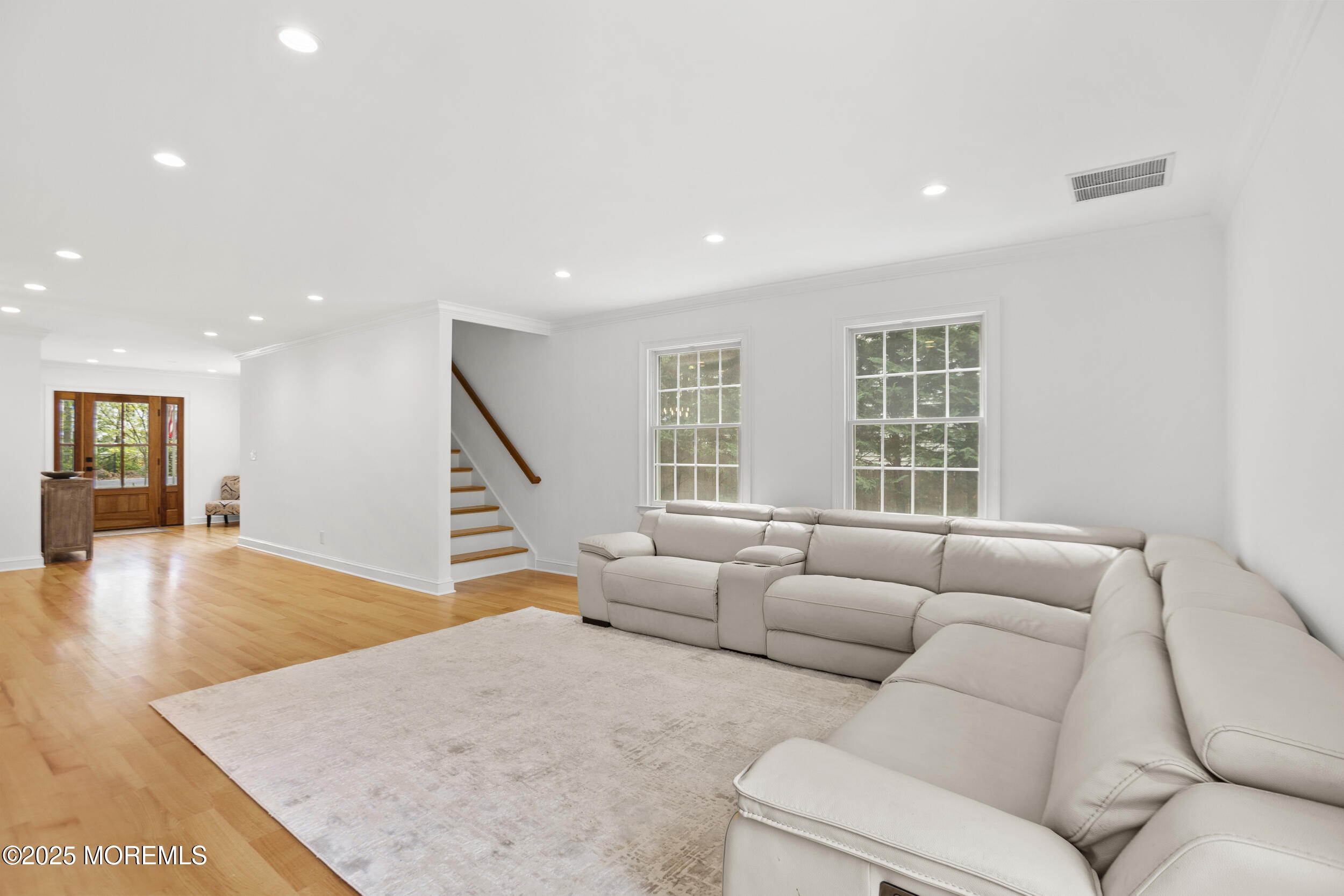 196 Highwood Road Oakhurst, NJ 07755 - Photo 15 of 32 a living room with furniture and a hard wood floor