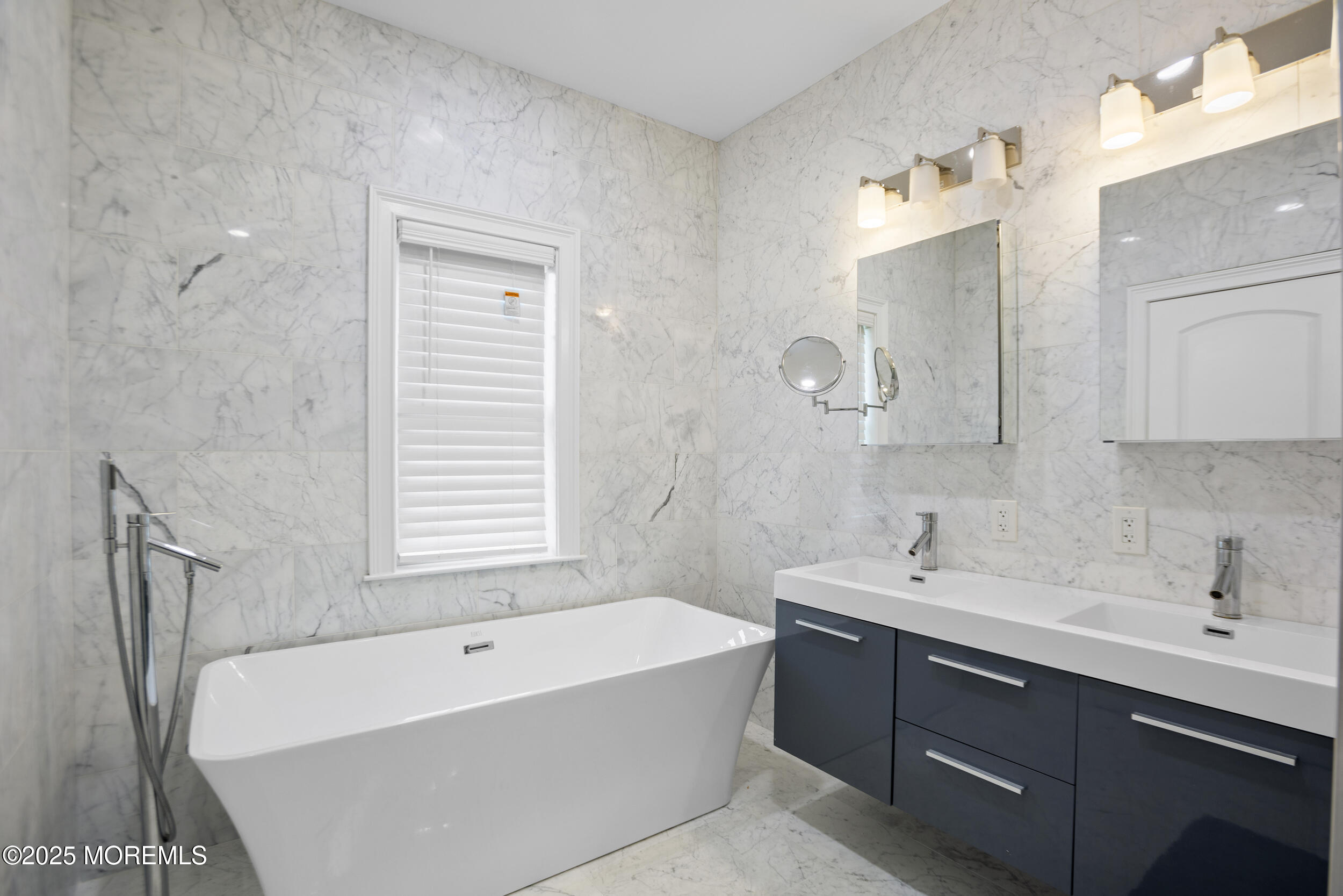 196 Highwood Road Oakhurst, NJ 07755 - Photo 24 of 32 a bathroom with a tub sink and mirror
