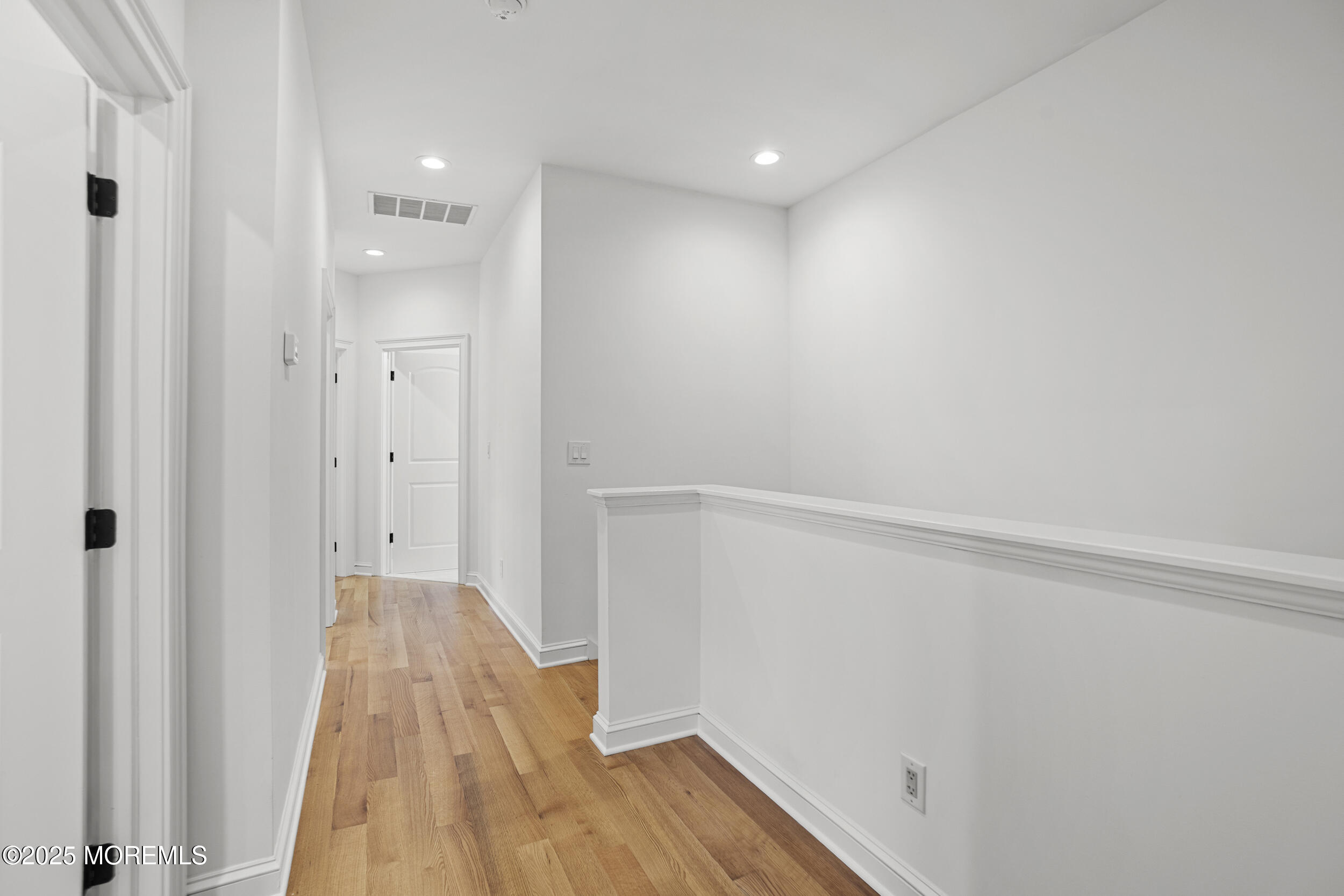 196 Highwood Road Oakhurst, NJ 07755 - Photo 25 of 32 a view of a room with wooden floor