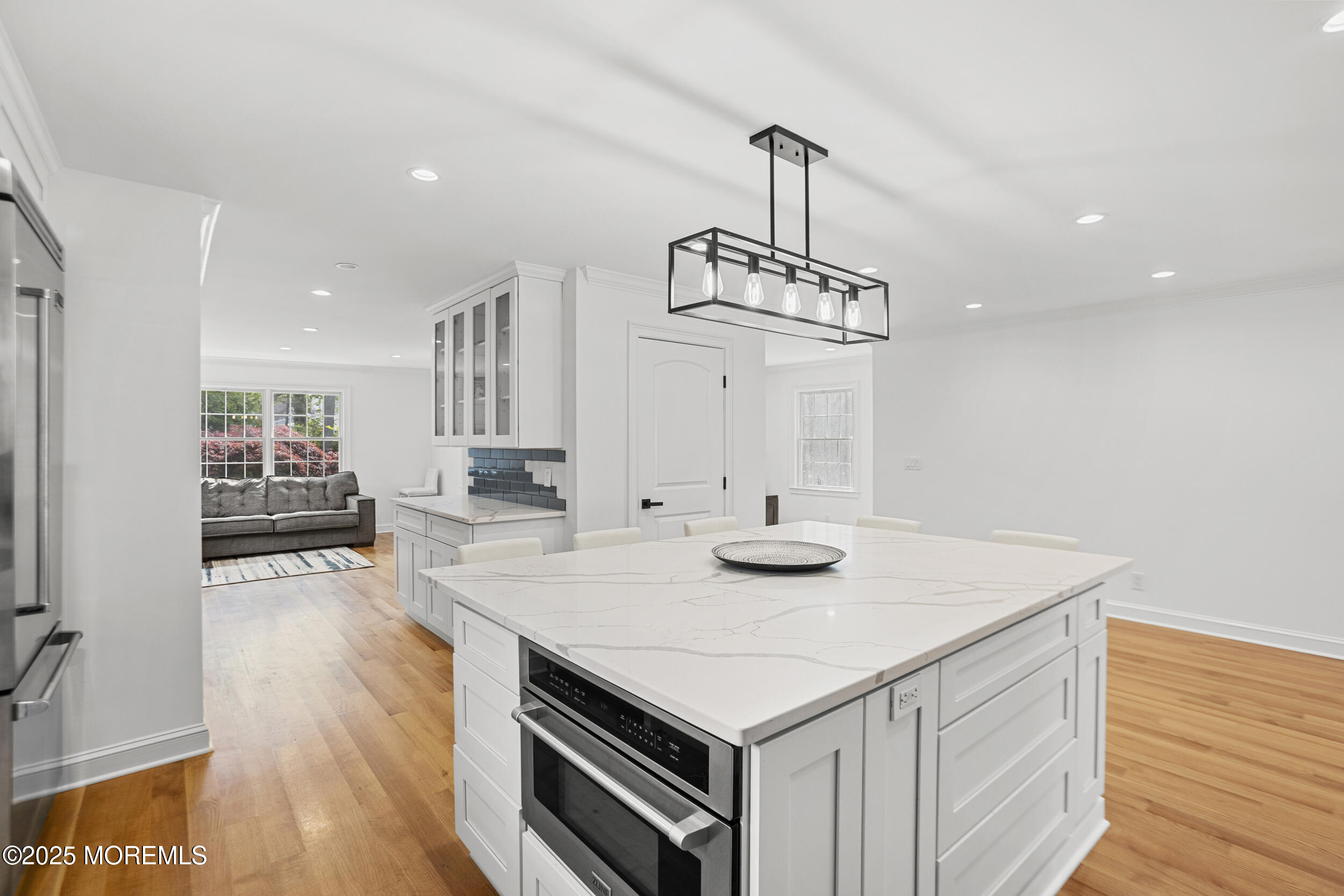 196 Highwood Road Oakhurst, NJ 07755 - Photo 8 of 32 a view of kitchen island and living room