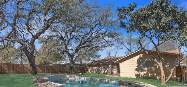 a view of backyard with green space