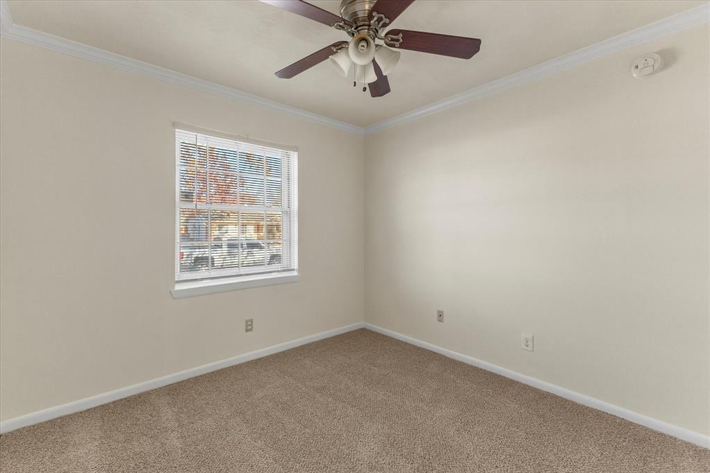 4110 Colgate Lane Garland, TX 75042 - Photo 18 of 22 an empty room with a window and a fan