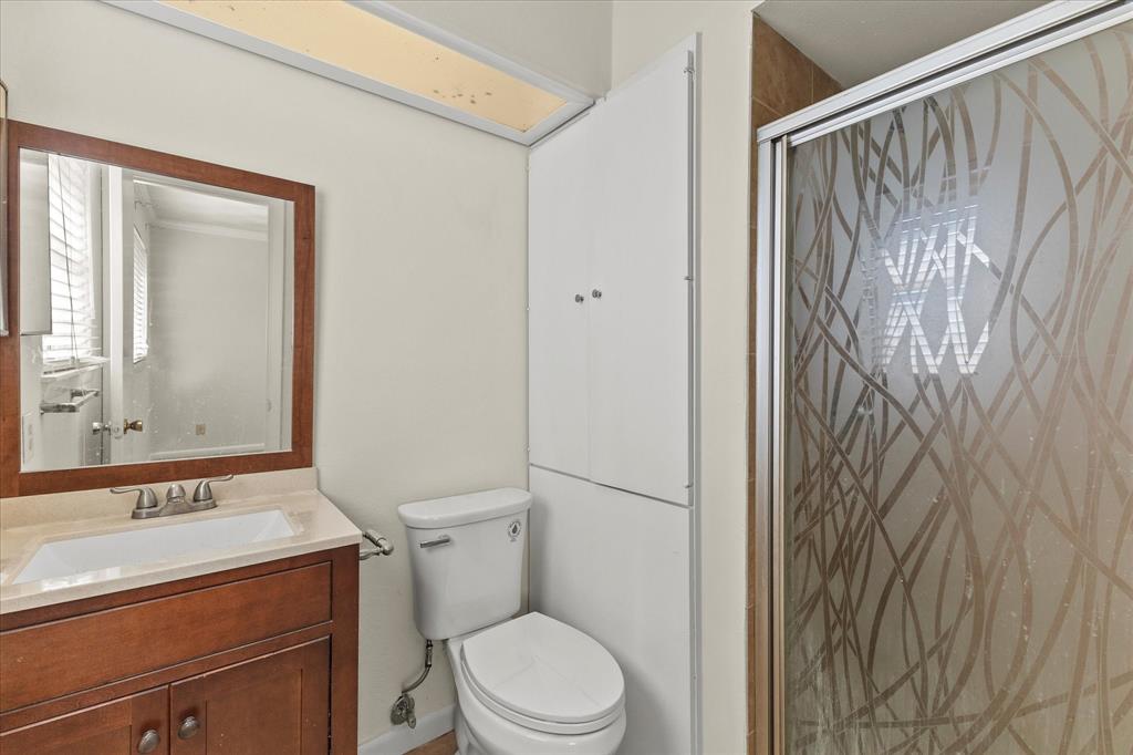 4110 Colgate Lane Garland, TX 75042 - Photo 22 of 22 a bathroom with a granite countertop sink toilet and shower