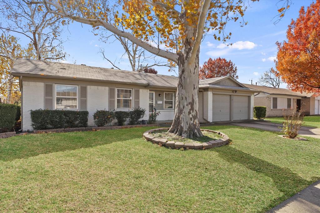4110 Colgate Lane Garland, TX 75042 - Photo 3 of 22 a front view of a house with a yard